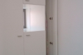 schlafzimmer-schrank-mit-tv-fach-detail-bugelbrett-fach-1